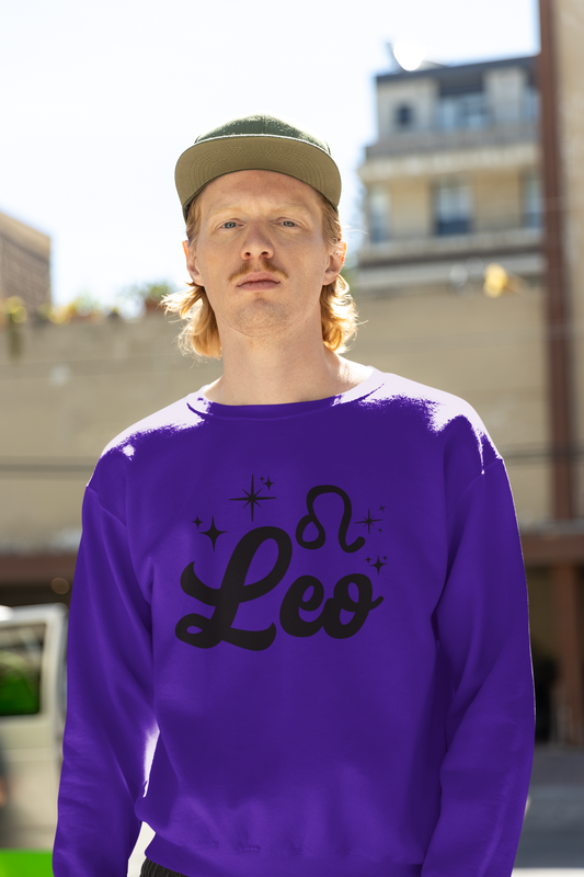Person wearing a purple sweatshirt with 'Leo' black text, standing outdoors.