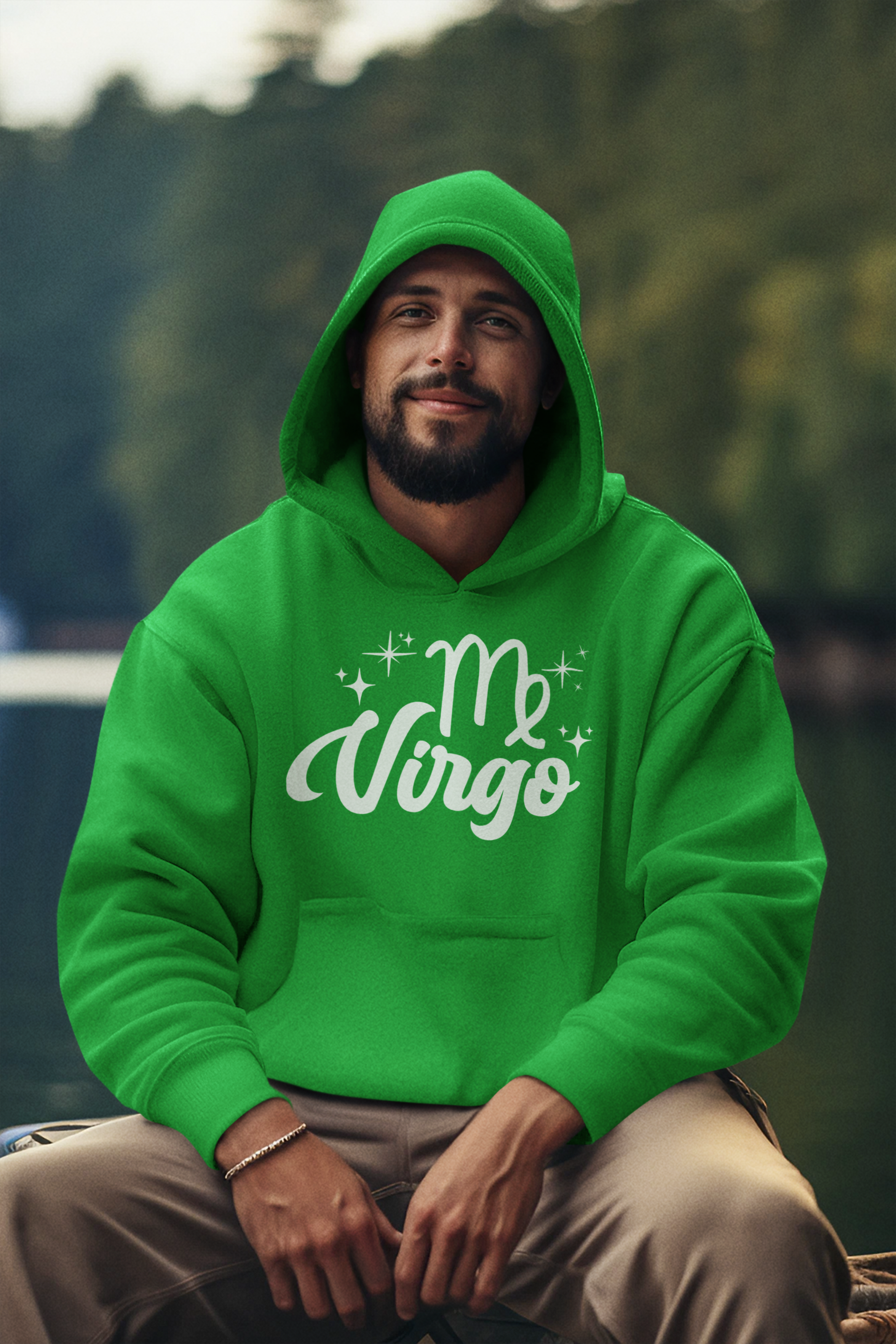 Man wearing a green hoodie with 'Virgo' white text design, sitting outdoors with a blurred natural background