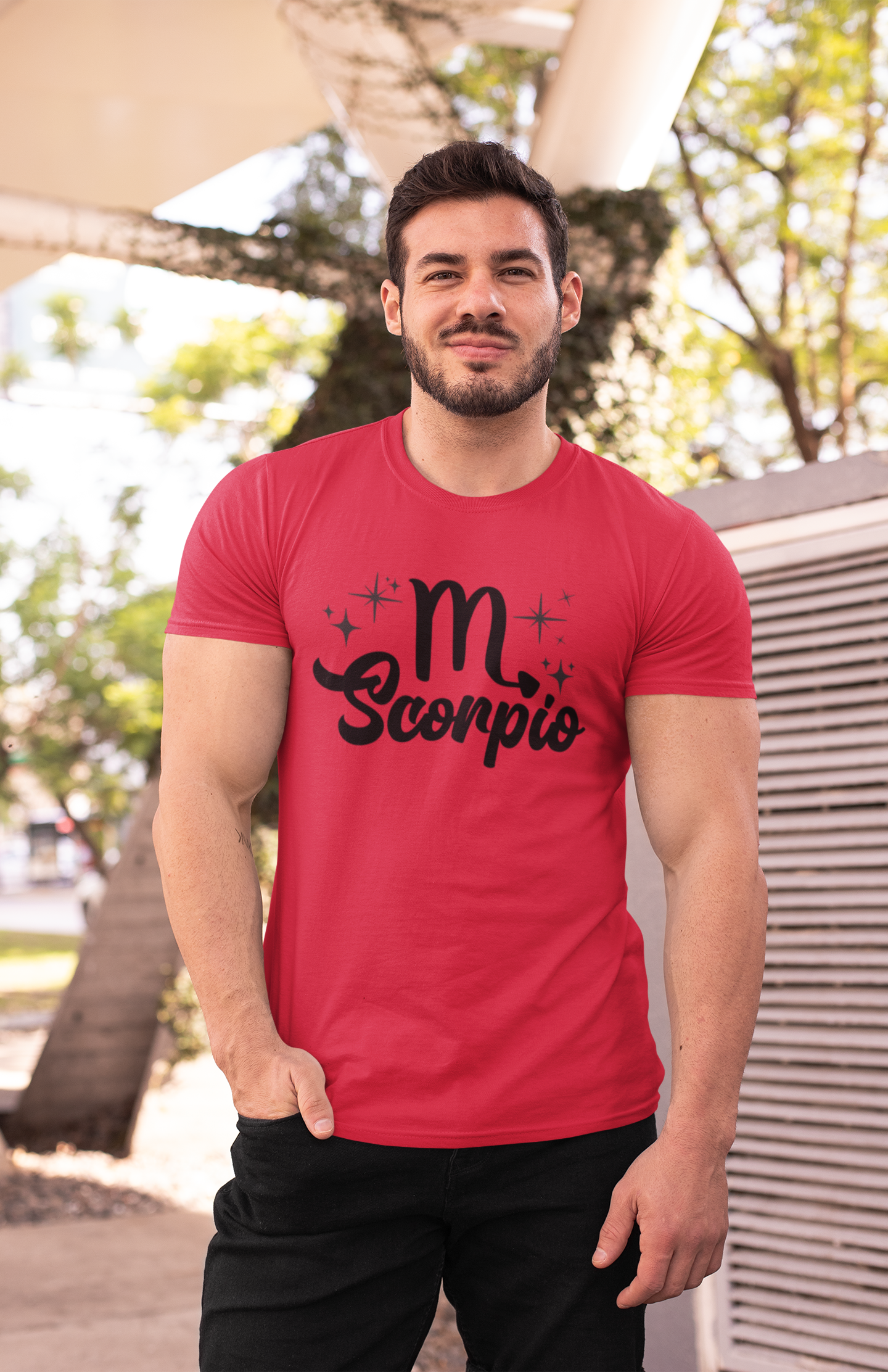 Man wearing an red t-shirt with 'Scorpio' black text design outdoors.