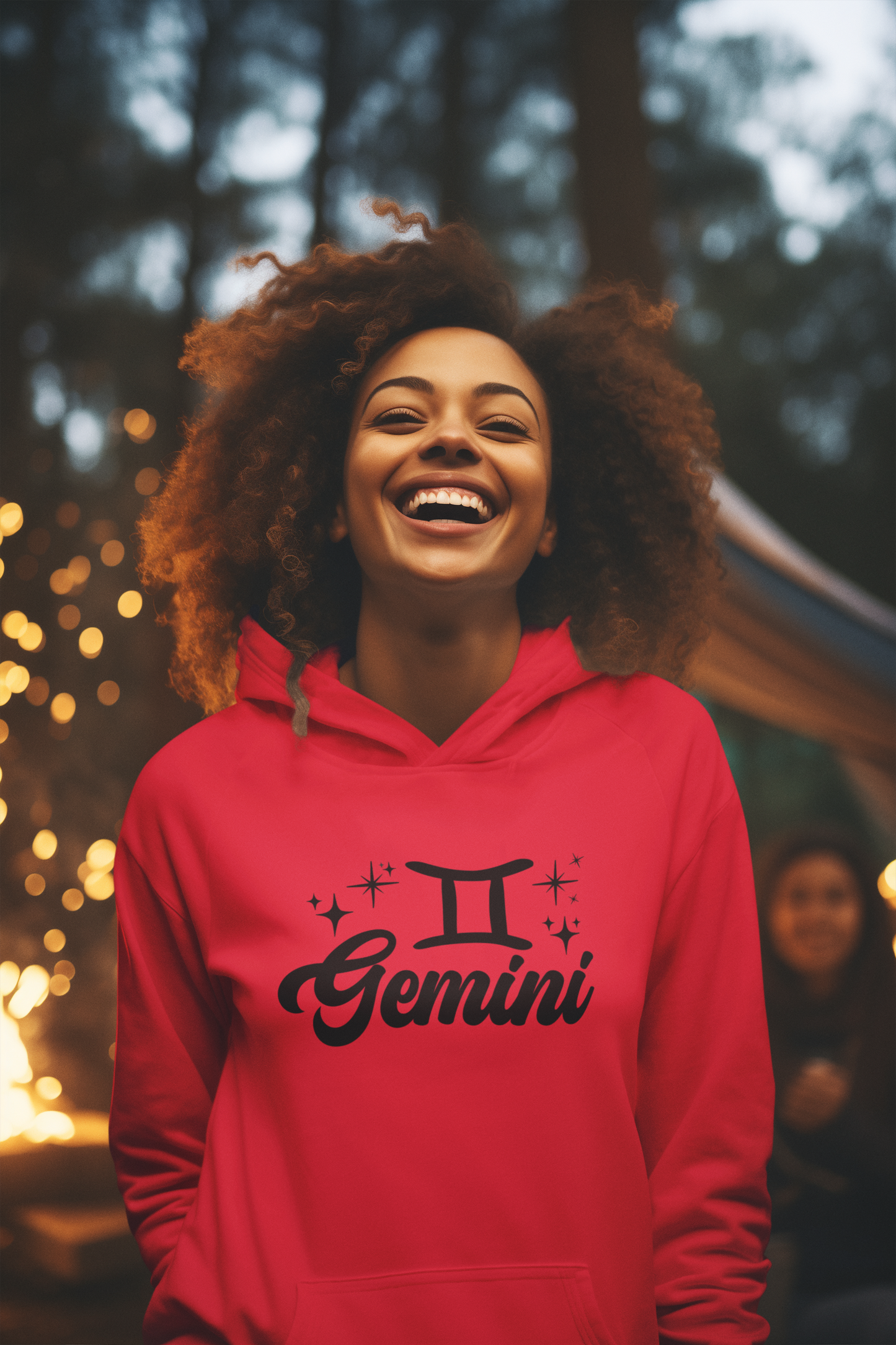 Person wearing a red hoodie with 'Gemini' black design in a festive outdoor setting