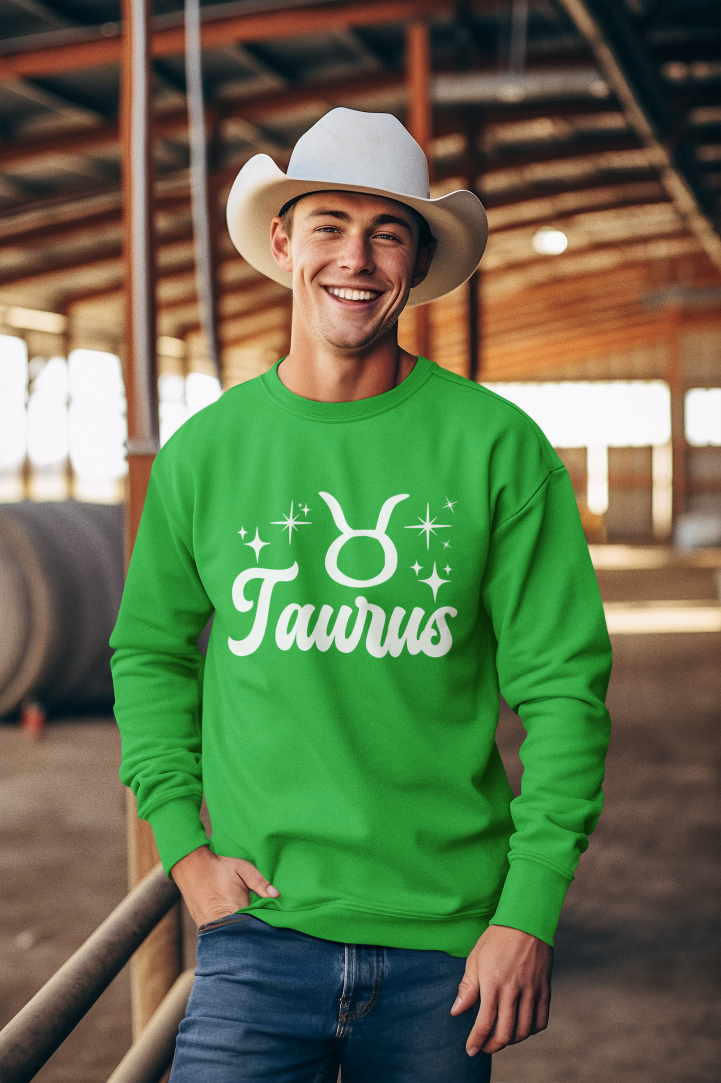 Man wearing a green 'Taurus' white text design sweatshirt in an barn setting