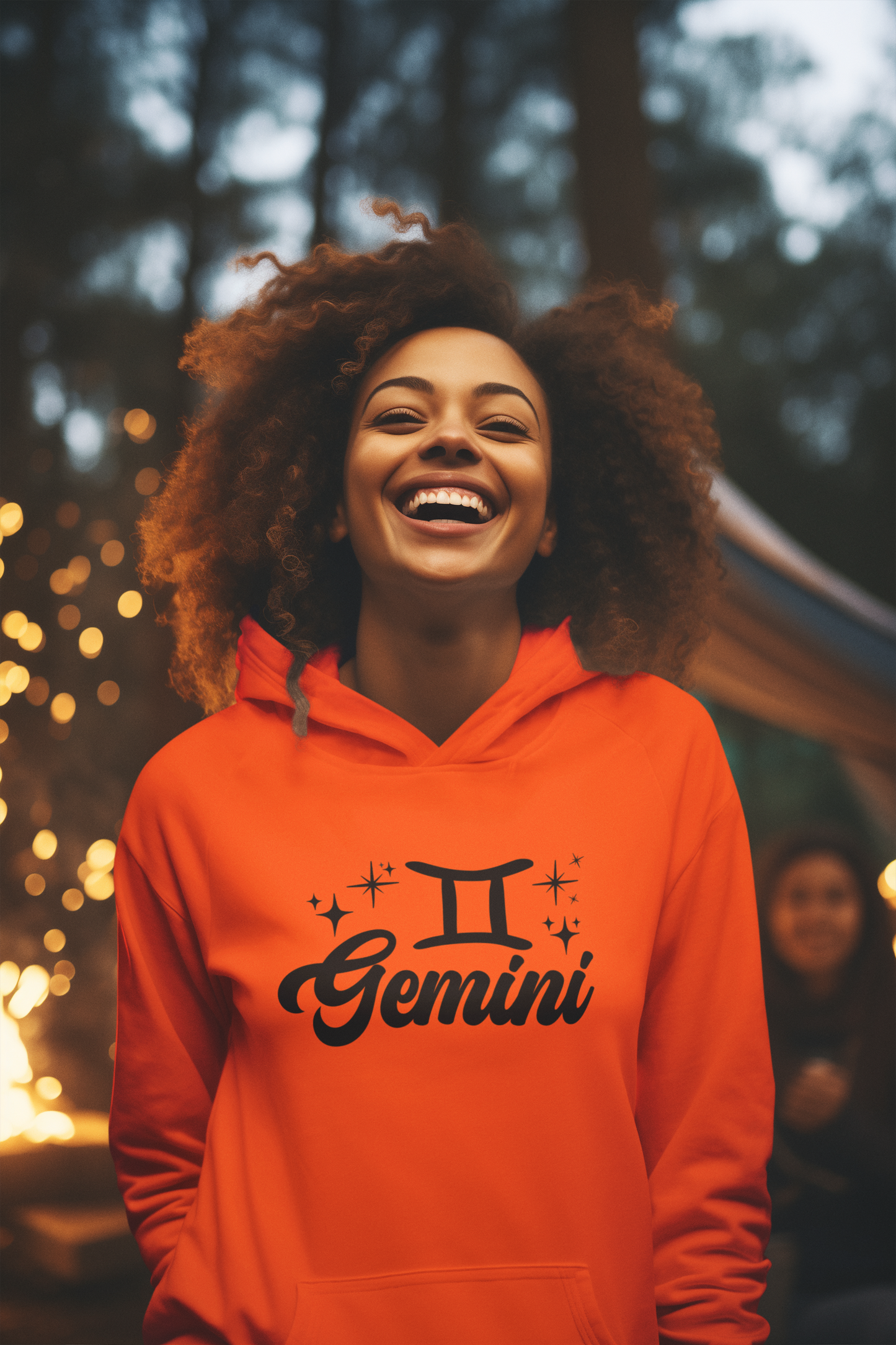 Person wearing a orange hoodie with 'Gemini' black design in a festive outdoor setting