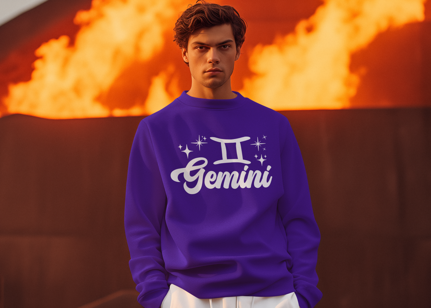 Person wearing a purple 'Gemini' white text sweatshirt in front of a fiery background