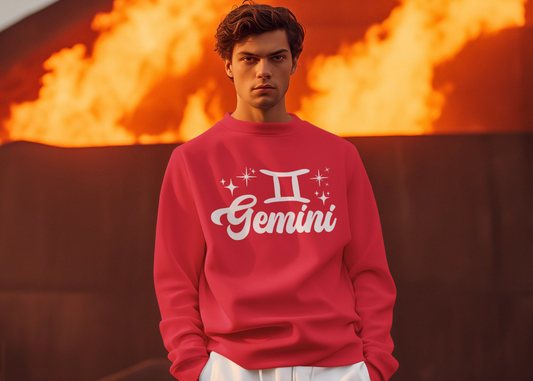 Person wearing a red 'Gemini' white text sweatshirt in front of a fiery background