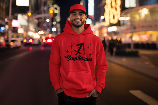 Person wearing a red hoodie with 'Sagittarius' black design on a city street at night.